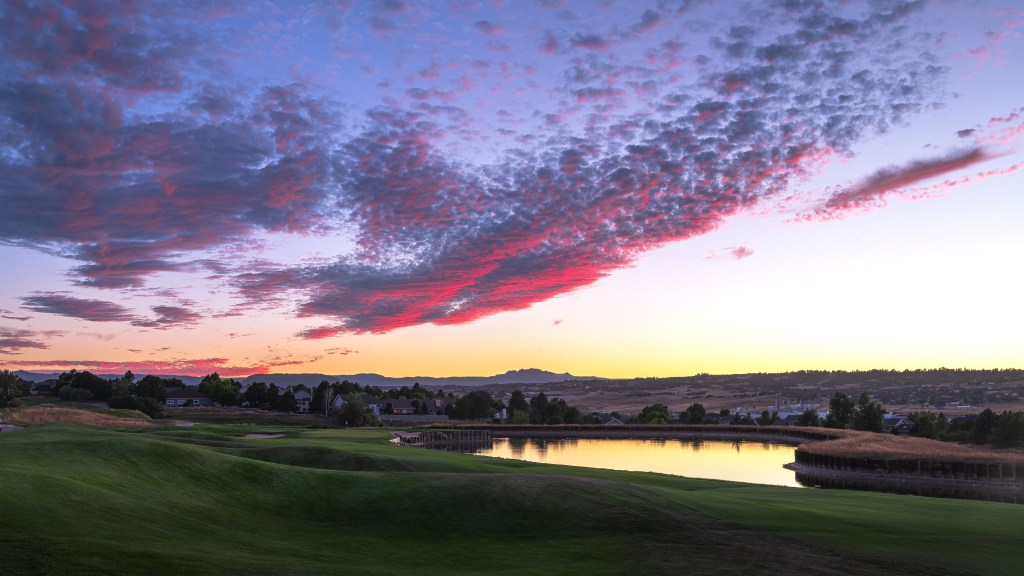 sunset view of the golf course lake 